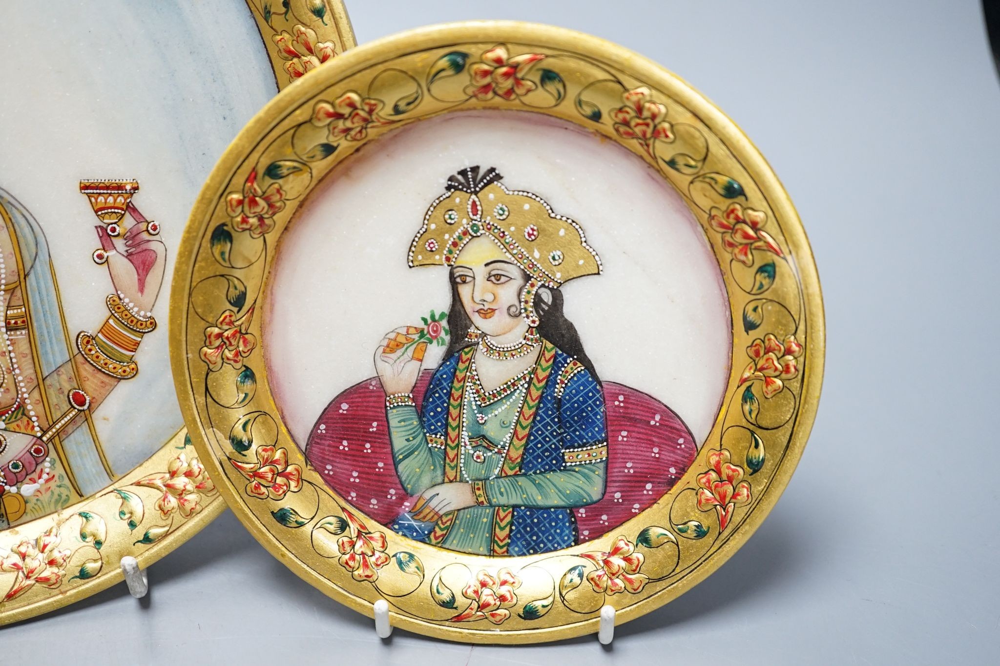 Three Indian alabaster, gilt bordered plates depicting Indian Royalty, 22cm